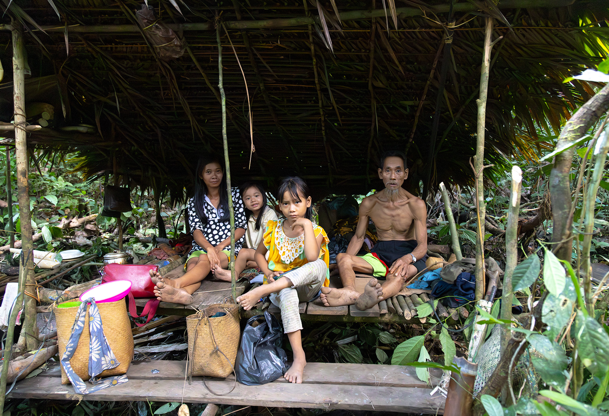 Cave Punan Batu - Hunter-gatherers - family portrait in their hut