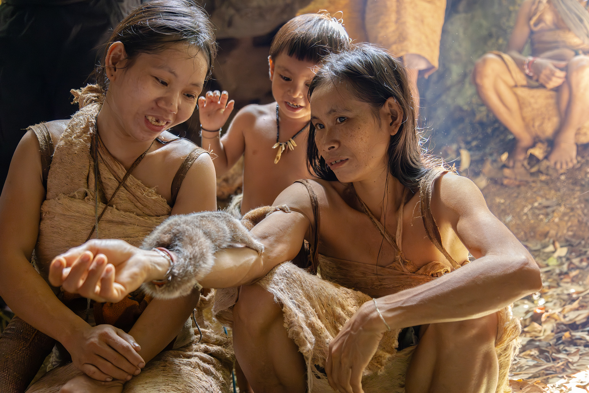 Punan Batu - Hunter-gatherers tribe members with their pet monkeys.